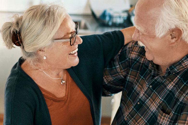 Elderly couple embracing